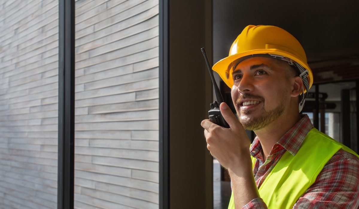 Young engineers use radio communication to coordinate the remote.